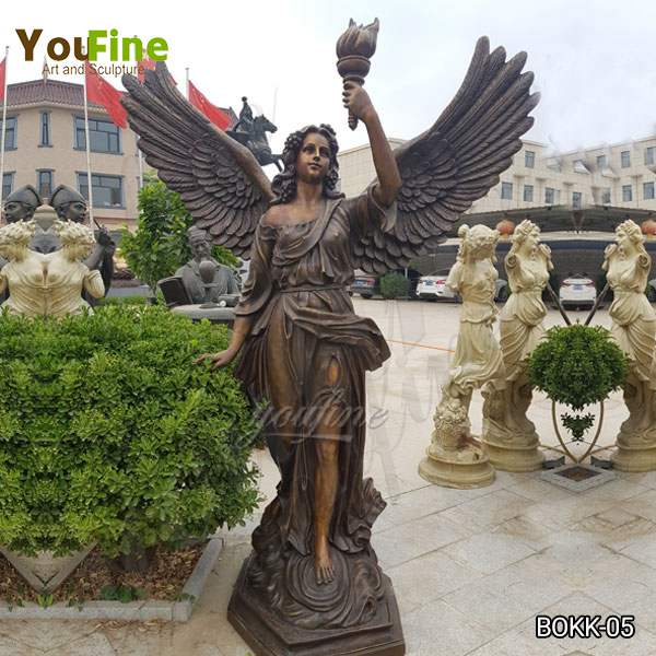 bronze torch angel sculpture