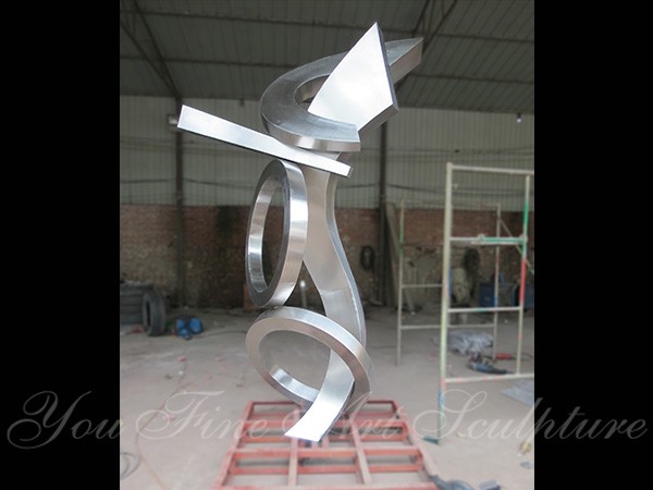 Large stainless steel clock sculptures