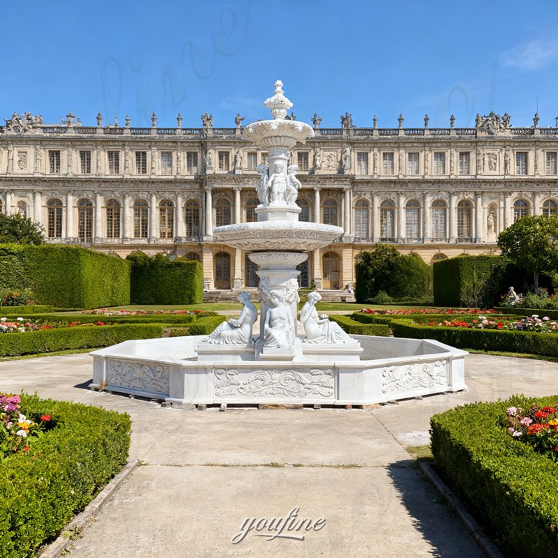 large marble fountain with statue