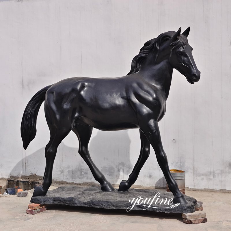 black walking horse statue