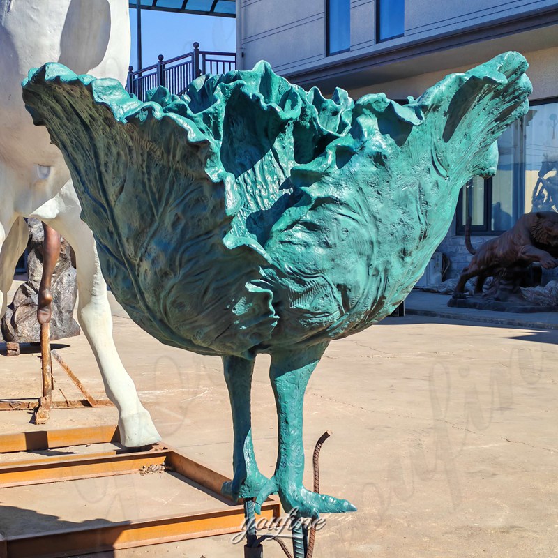 bronze cabbage sculpture with feet