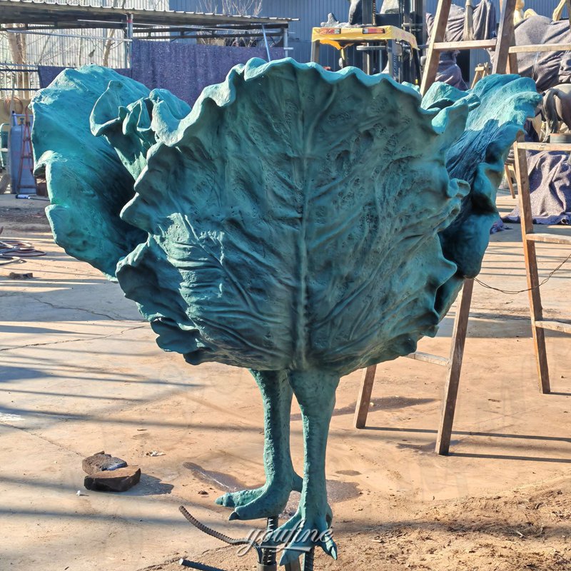 bronze cabbage with feet sculpture