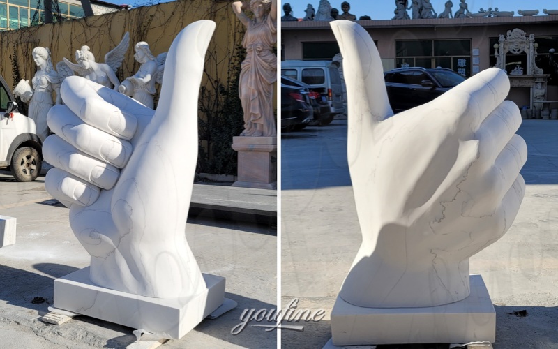 Marble thumbs up sign detail