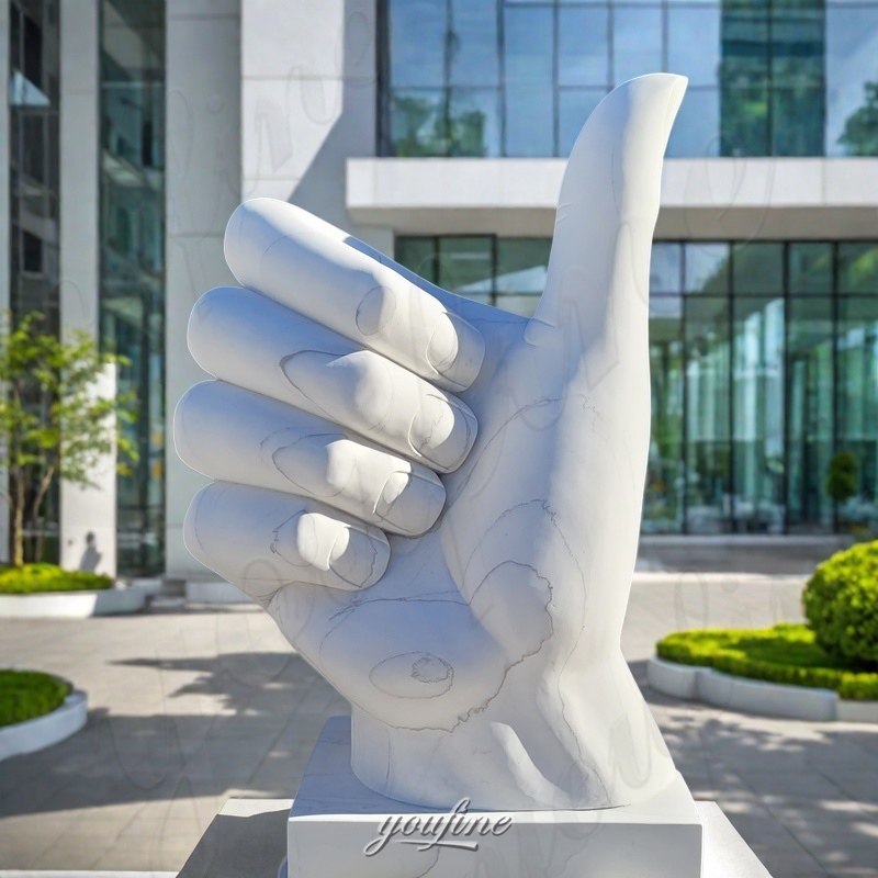 Marble thumbs up sign sculpture