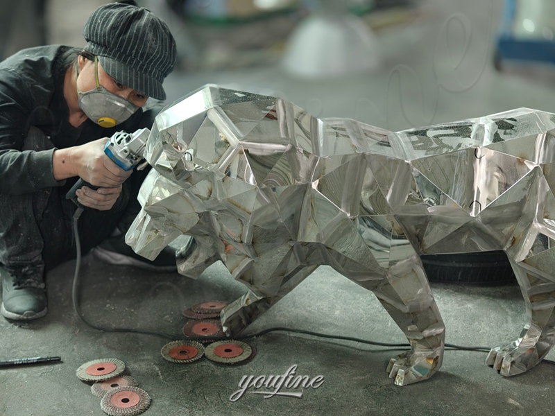 geometric lion statue polishing