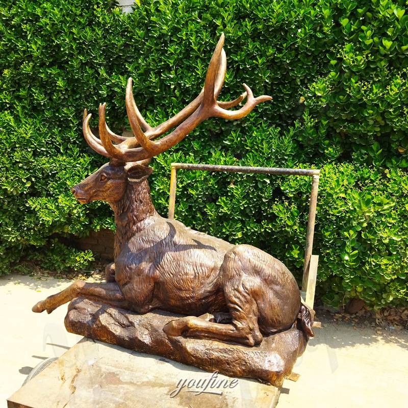 laying deer bronze sculpture