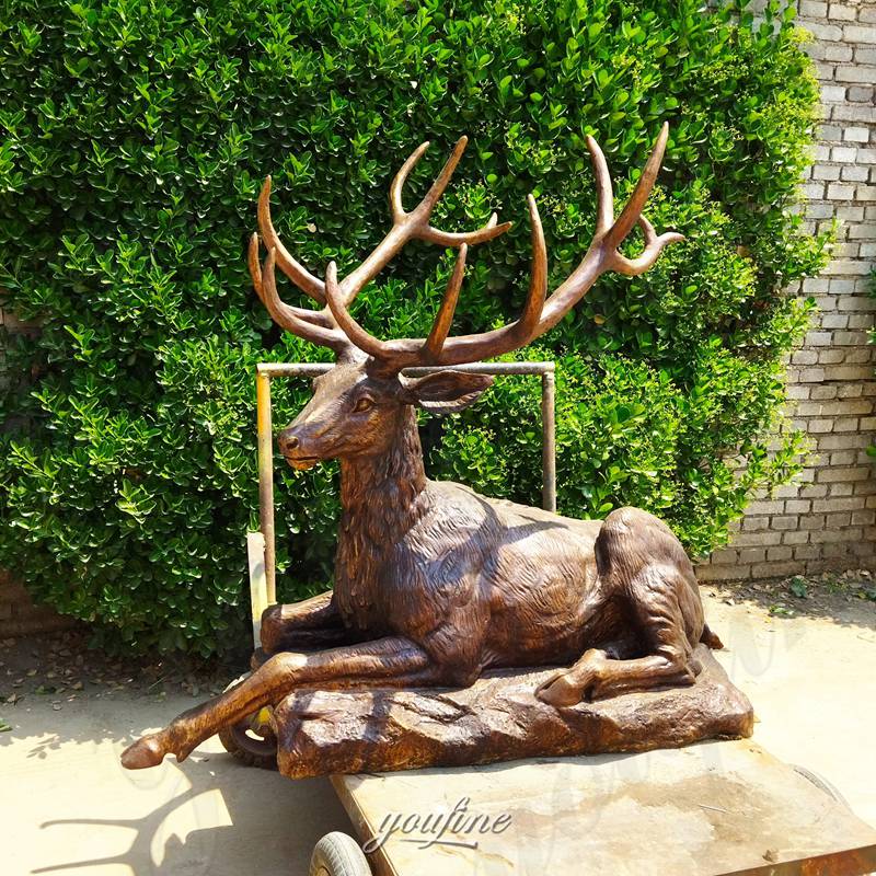 laying deer sculpture for garden