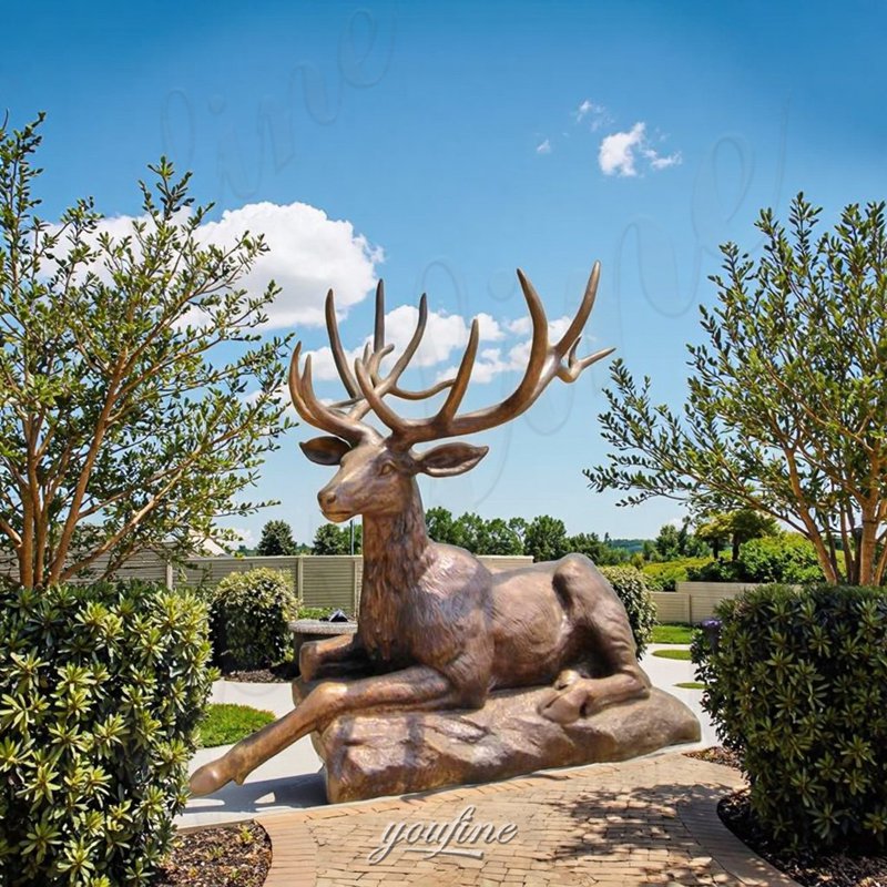 laying deer sculpture