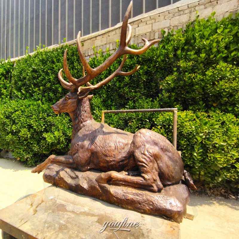 life size laying deer sculpture