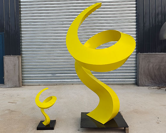stainless steel yellow sculpture