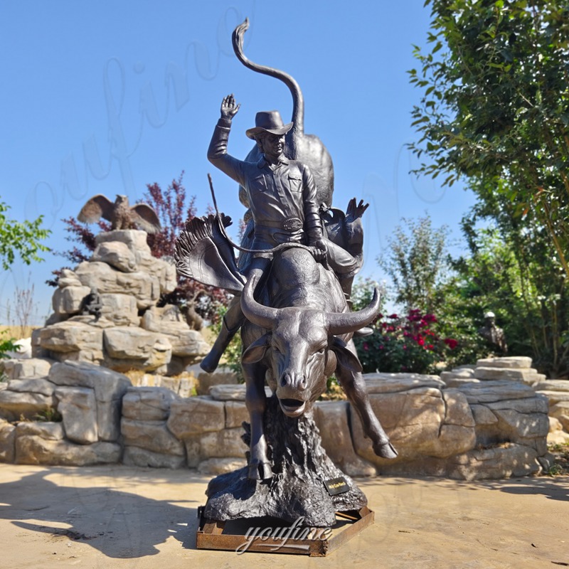 bronze bull riding sculpture