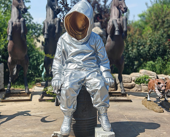 large cast aluminum astronaut statue