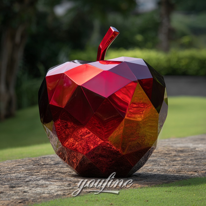 red metal big apple sculpture
