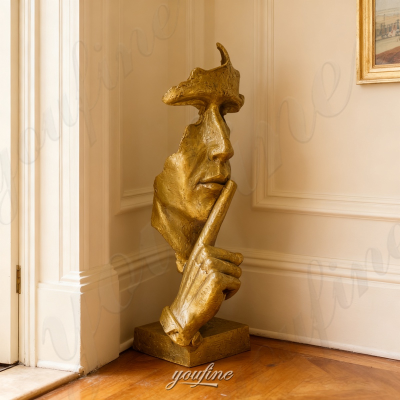 silence is golden sculpture