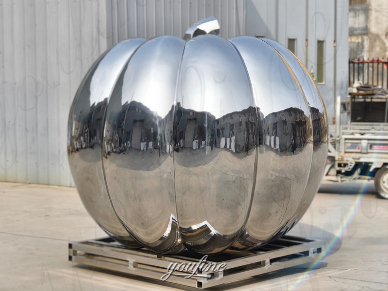 poished metal pumpkin sculpture