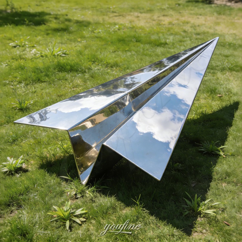 metal paper airplane sculpture