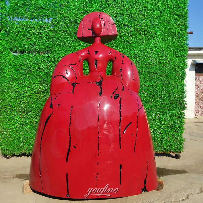 red Reina Mariana sculpture