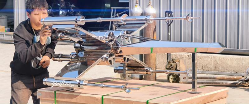 mirror X-wing fighter jet sculpture