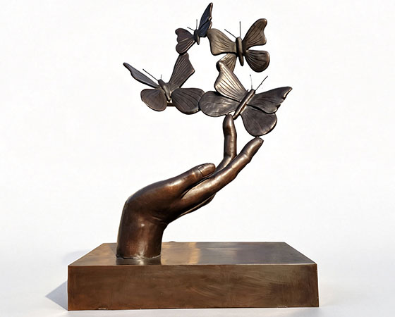 butterfly on hand sculpture