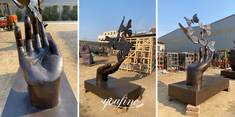 different angle of butterfly on hand sculpture