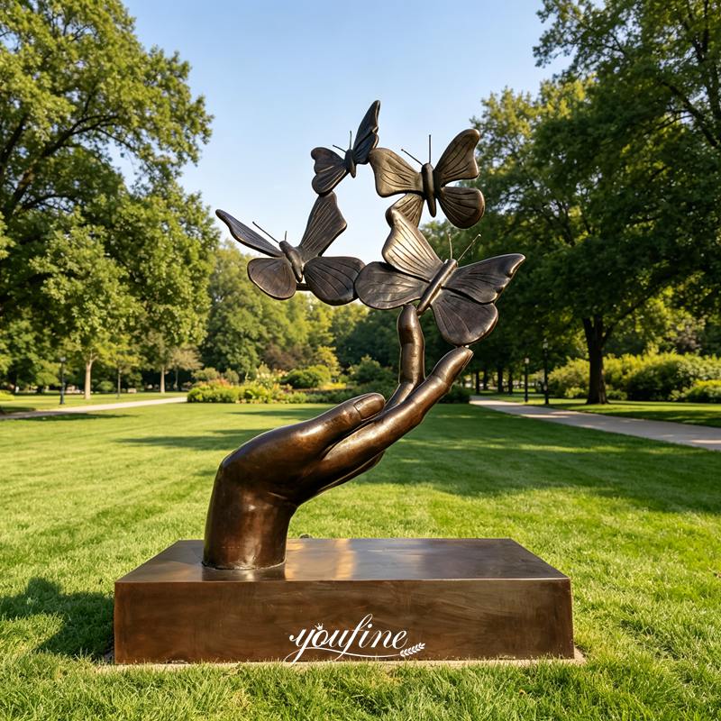 large butterfly on hand sculpture