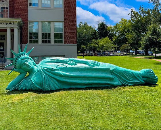 bronze liberty lying down