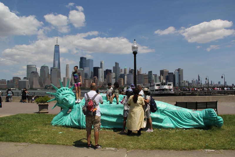 bronze statue of liberty lying down