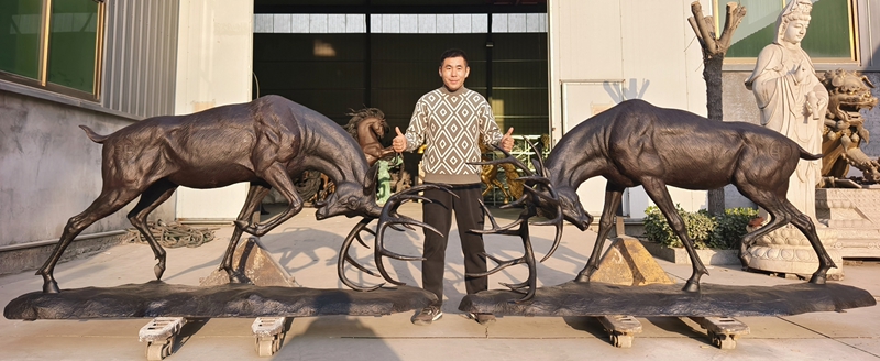 bronze fighting deer sculpture