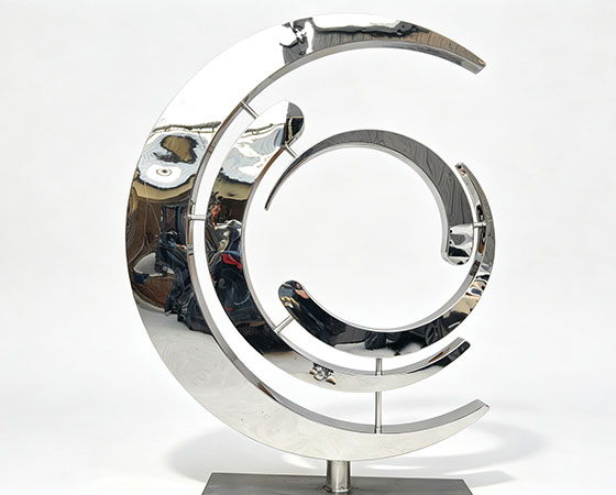 metal crescent sculpture