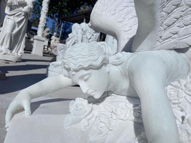 mourning angel statue carving detail