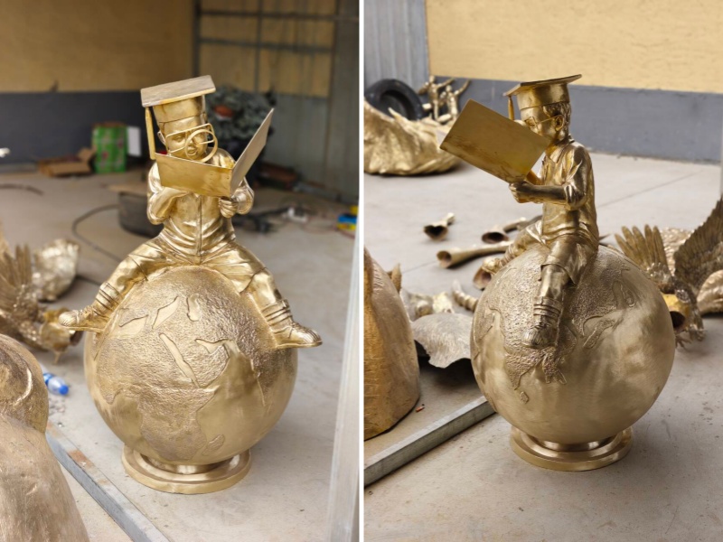 boy reading book sculpture after polishing