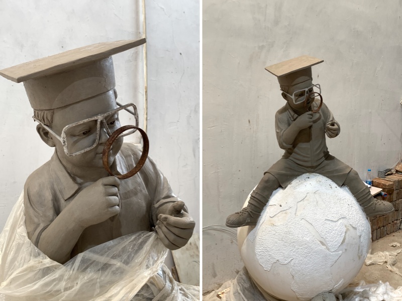 boy reading book sculpture clay model