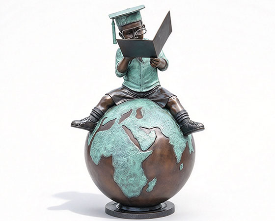 boy reading book statue